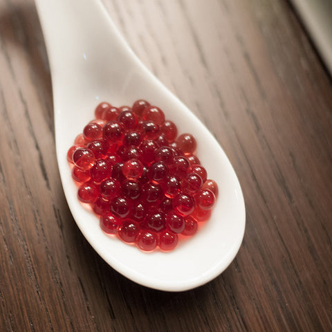 Spherification Basics 101 - Fruit caviar pearls in a spoon